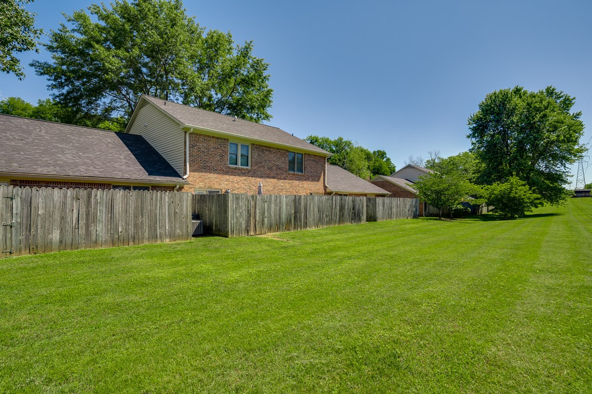 711 Kent Road Nashville, TN 37214 - Photo 30 of 31 a view of a backyard with a cabin and wooden fence