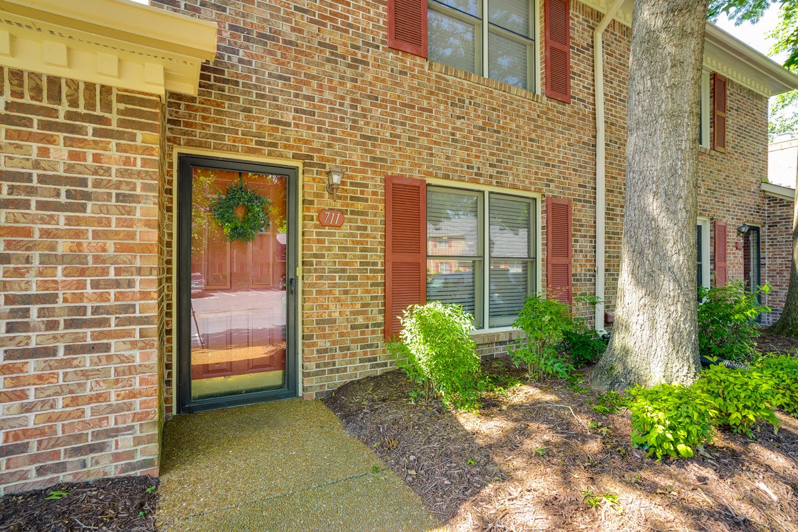 711 Kent Road Nashville, TN 37214 - Photo 4 of 31 a view of a brick house with a large windows