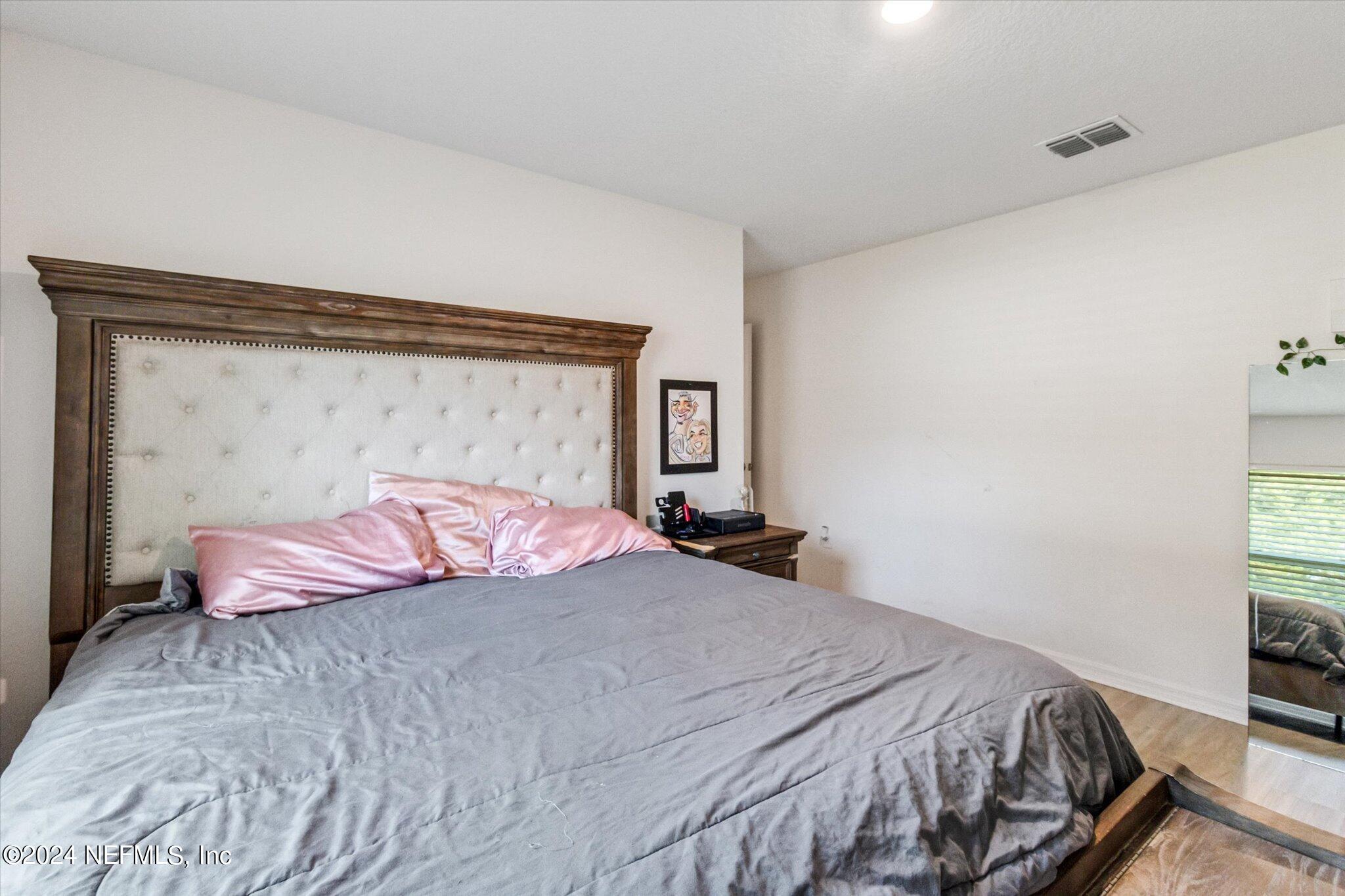 3 Pinwheel Lane Palm Coast, FL 32164 - Photo 11 of 20 a bedroom with a bed and a window