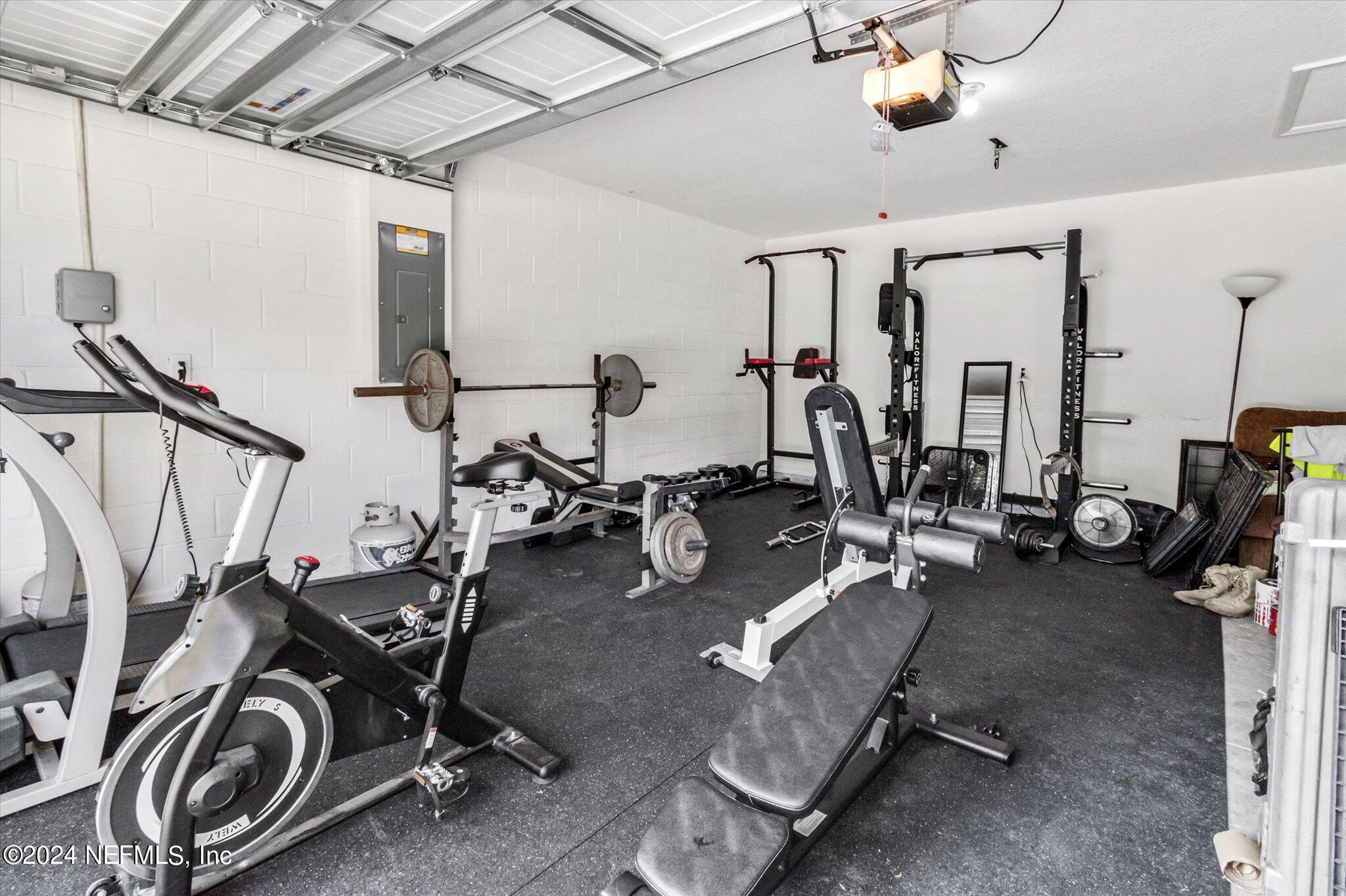 3 Pinwheel Lane Palm Coast, FL 32164 - Photo 17 of 20 a view of a room with gym equipment