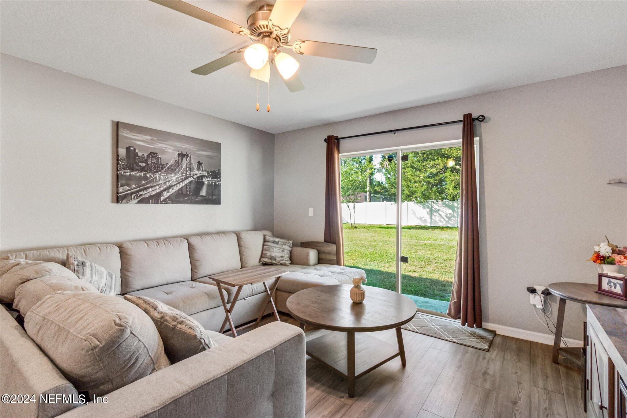 3 Pinwheel Lane Palm Coast, FL 32164 - Photo 7 of 20 a living room with furniture and a window