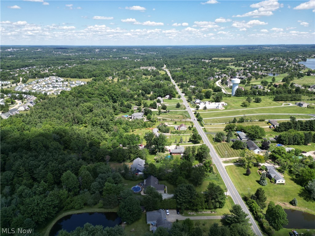 4553 Sharon Copley Road Medina, OH 44256 - Photo 32 of 32 Expansive aerial view showcasing a diverse landscape of residential areas, mature tree lines, and open green spaces