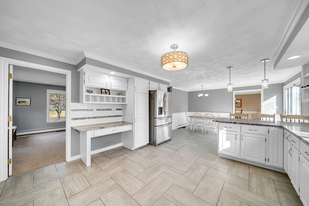 315 Candlestick Road North Andover, MA 01845 - Photo 9 of 42 a kitchen with a sink and refrigerator