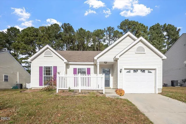 a view of a backyard of the house