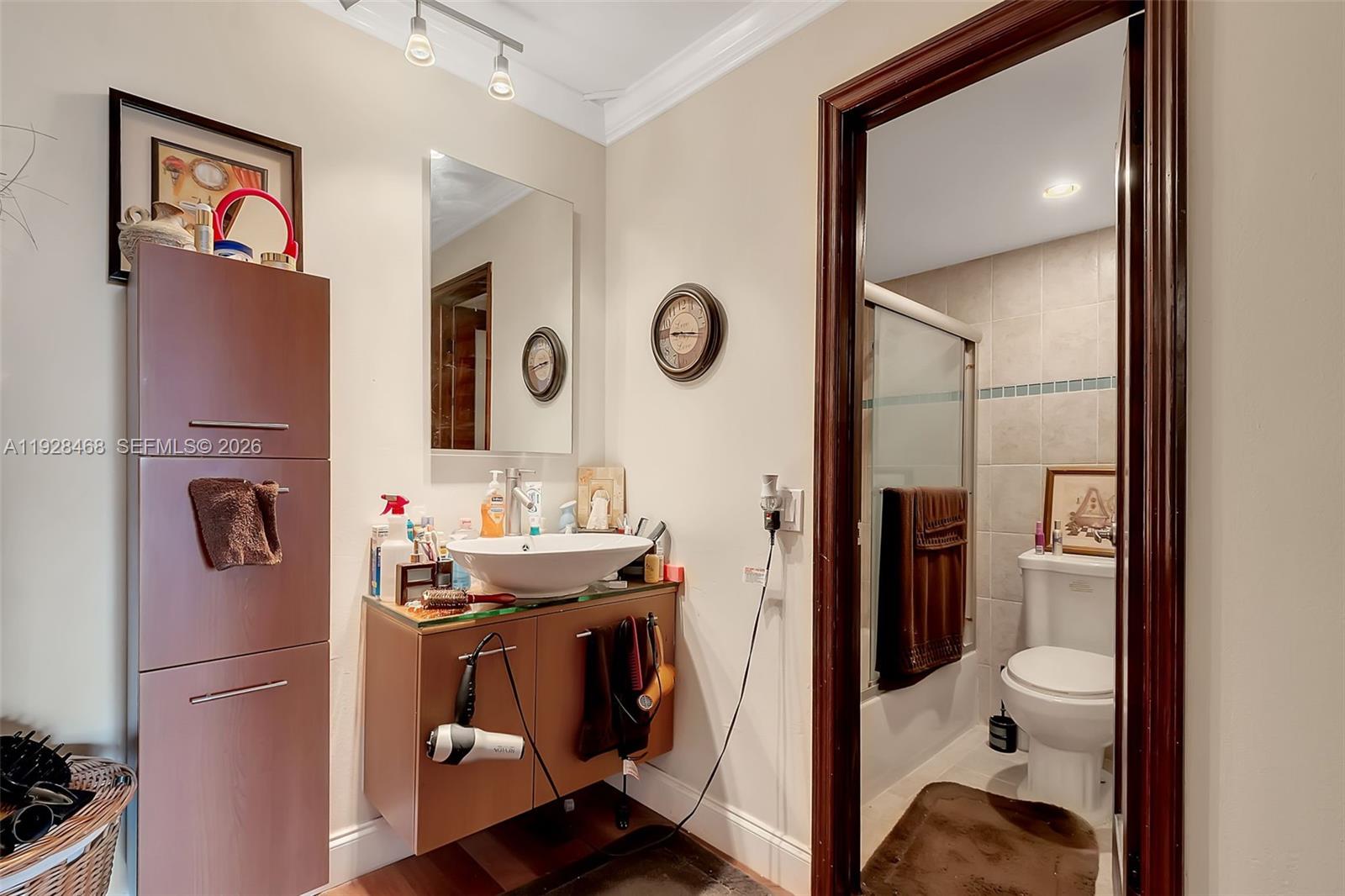 14250 Southwest 62nd Street, Unit 118 Miami, FL 33183 - Photo 14 of 23 a view of a hallway with washer and dryer