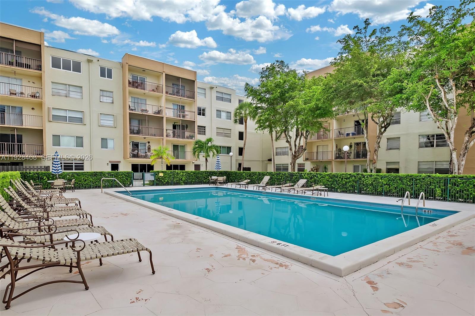 14250 Southwest 62nd Street, Unit 118 Miami, FL 33183 - Photo 20 of 23 a view of a house with backyard and sitting area