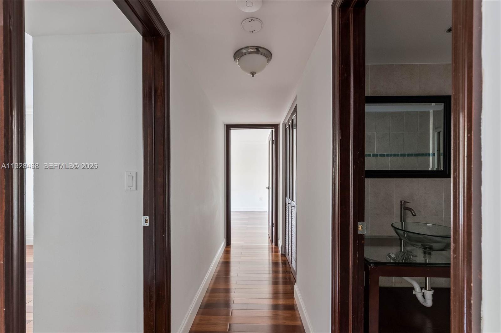 14250 Southwest 62nd Street, Unit 118 Miami, FL 33183 - Photo 6 of 23 a view of a bathroom from the hallway