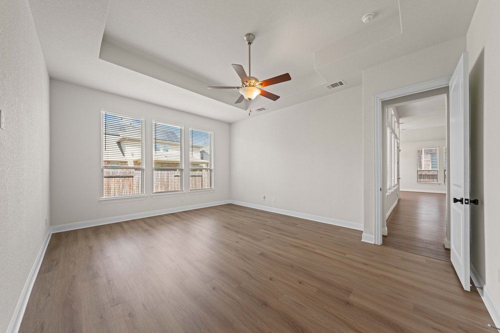 4208 Brean Down Road Pflugerville, TX 78660 - Photo 17 of 31 Generous natural light streams across polished wood floors in this inviting space.