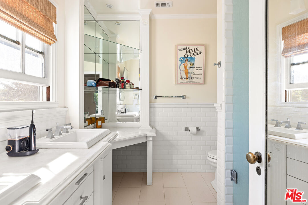 2186 San Pasqual Street Pasadena, CA 91107 - Photo 18 of 29 a bathroom with a sink double vanity and a shower