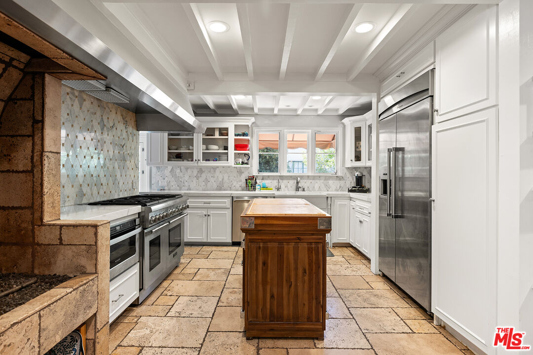 2186 San Pasqual Street Pasadena, CA 91107 - Photo 8 of 29 a kitchen with stainless steel appliances granite countertop a stove a sink and a refrigerator