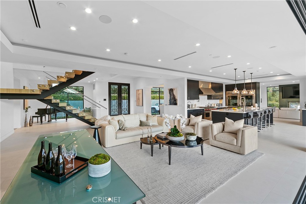15819 High Knoll Road Encino, CA 91436 - Photo 1 of 1 a living room with furniture and wooden floor