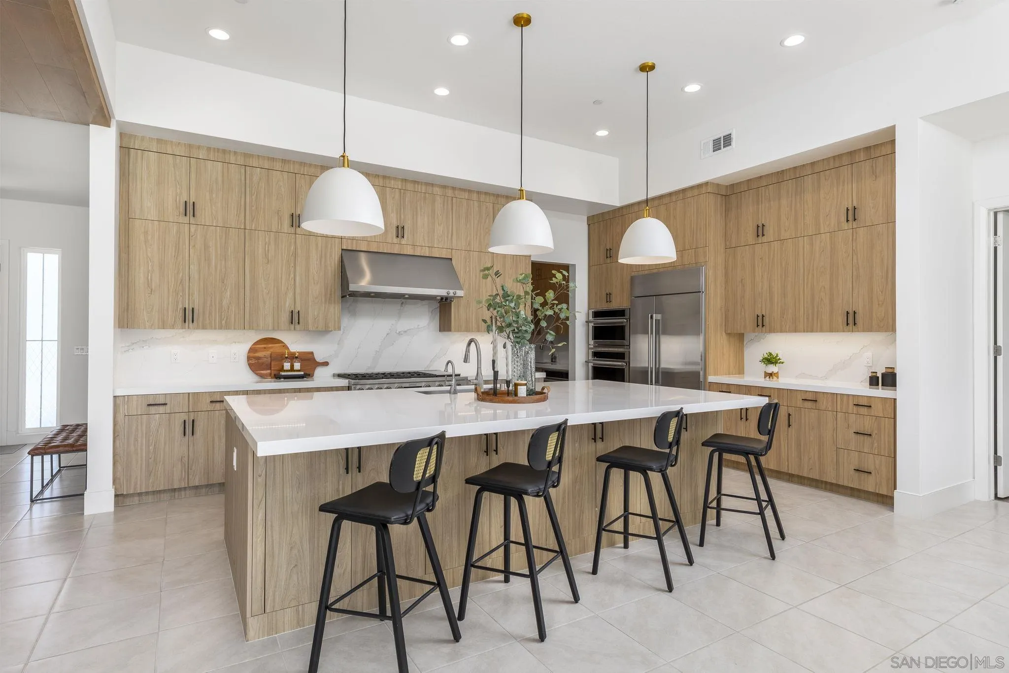 32213 Daybrook Terrace Temecula, CA 92591 - Photo 4 of 23 a kitchen with a table chairs sink and cabinets
