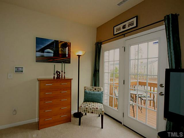 1635 Snow Mass Way Durham, NC 27713 - Photo 17 of 25 a living room with furniture and a flat screen tv