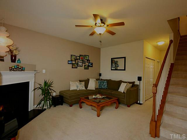 1635 Snow Mass Way Durham, NC 27713 - Photo 18 of 25 a living room with furniture and a fireplace
