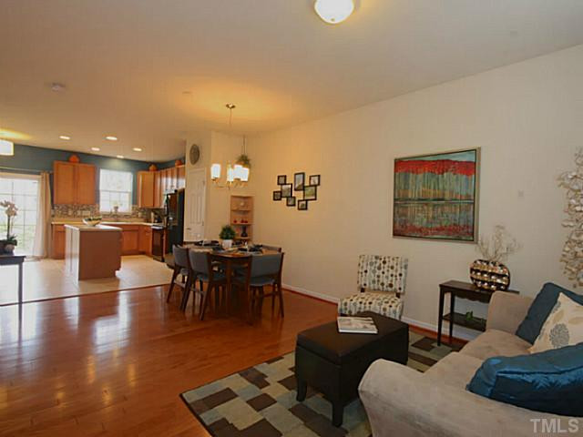1635 Snow Mass Way Durham, NC 27713 - Photo 2 of 25 a living room with furniture kitchen view and a dining table