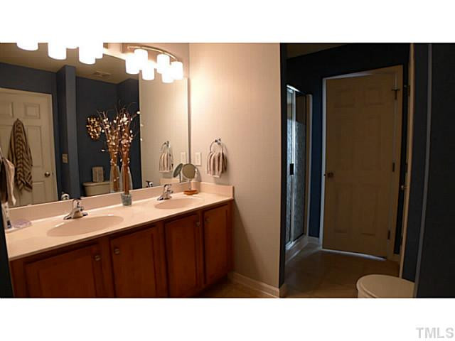 1635 Snow Mass Way Durham, NC 27713 - Photo 21 of 25 a bathroom with a sink vanity granite and a mirror
