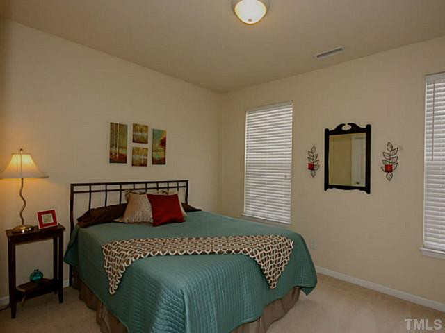 1635 Snow Mass Way Durham, NC 27713 - Photo 23 of 25 a bedroom with a bed and window