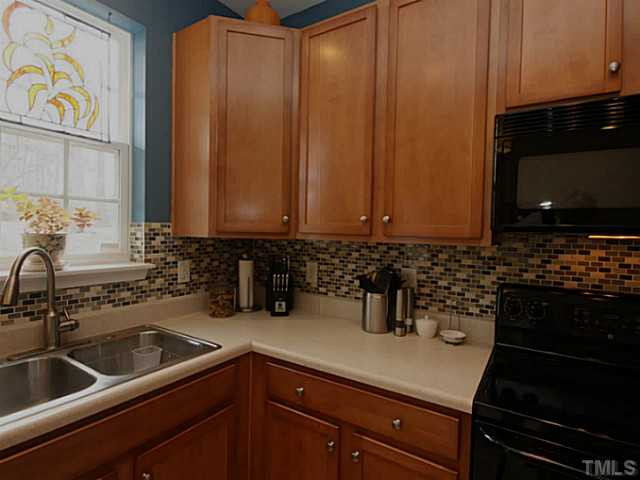 1635 Snow Mass Way Durham, NC 27713 - Photo 24 of 25 a kitchen with a sink and cabinets
