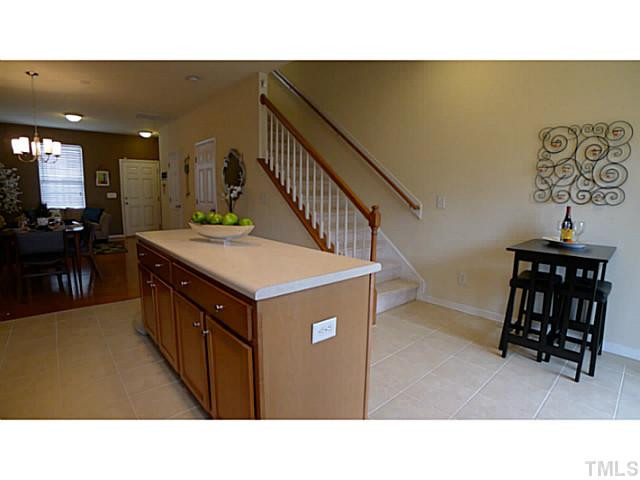 1635 Snow Mass Way Durham, NC 27713 - Photo 25 of 25 a kitchen with a sink a table and chairs