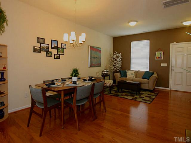 1635 Snow Mass Way Durham, NC 27713 - Photo 4 of 25 a living room with furniture and wooden floor