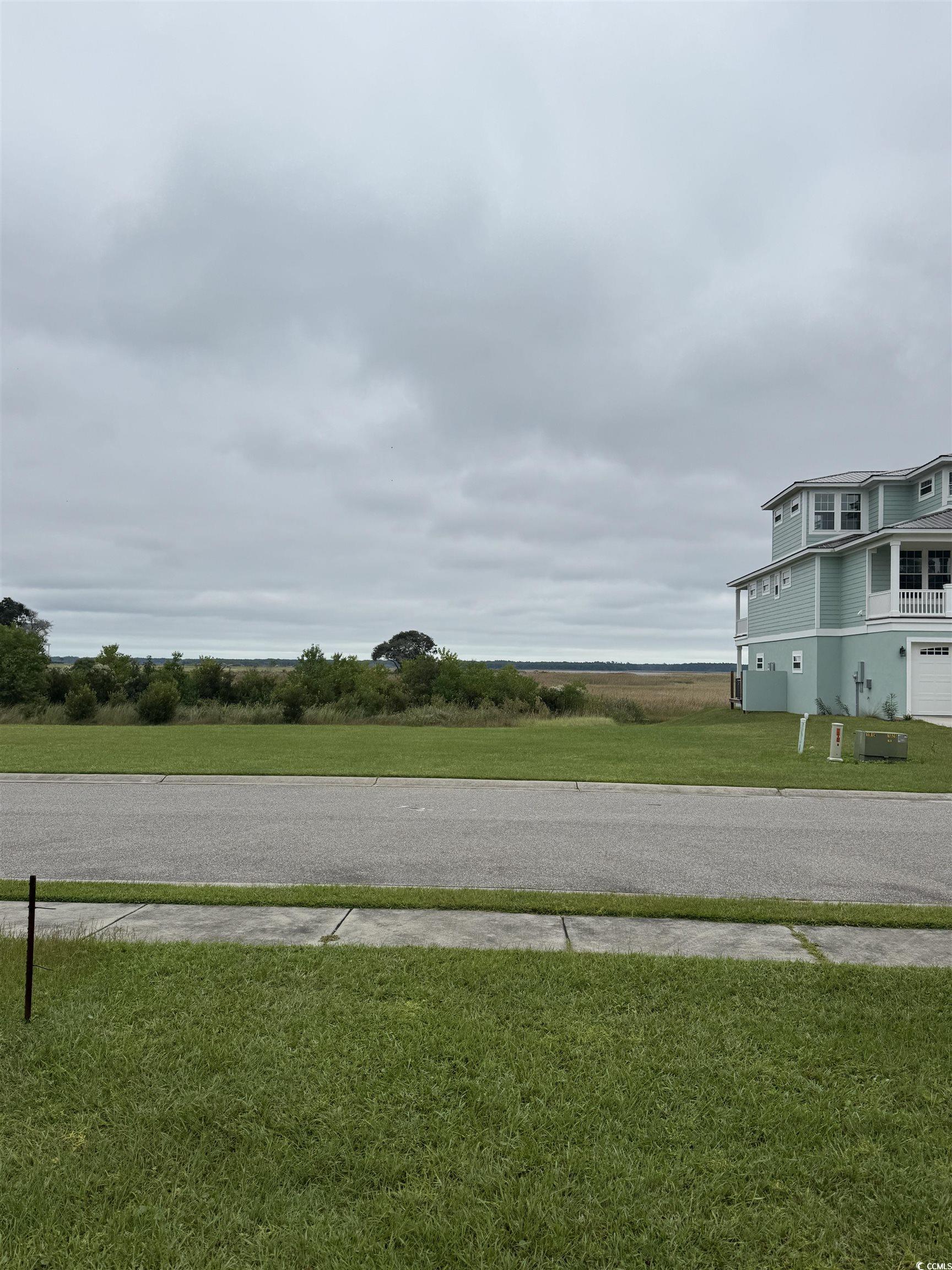 Lot 50 Oak Bay Drive Georgetown, SC 29440 - Photo 21 of 25 View of asphalt road featuring sidewalks