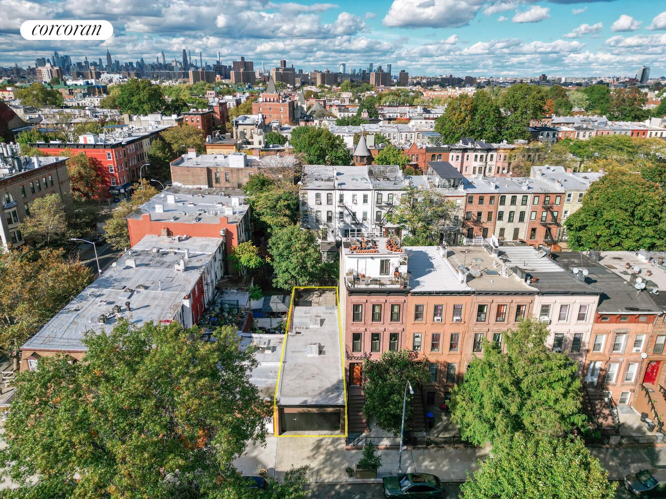 513 Hancock Street Brooklyn, NY 11233 - Photo 3 of 6 a view of a city that has tall buildings