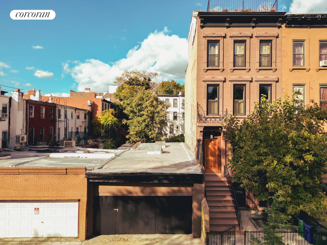 513 Hancock Street Brooklyn, NY 11233 - Photo 5 of 6 a building with trees in front of it