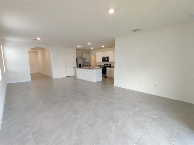 a view of a kitchen with a sink and cabinets