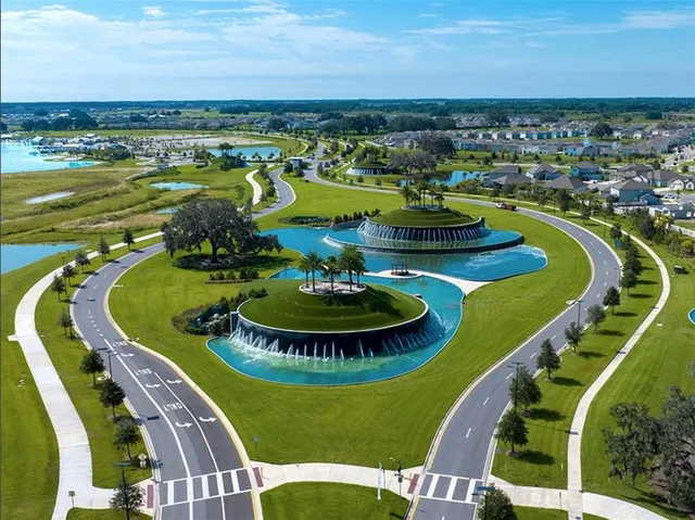 a view of a swimming pool with a table and chairs