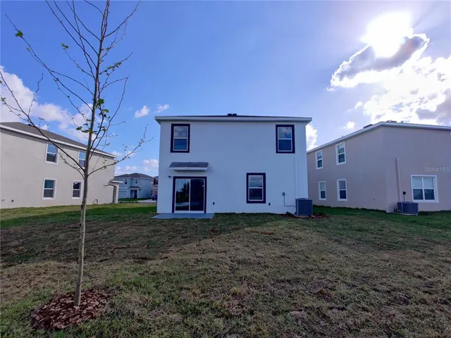 a house view with a backyard space
