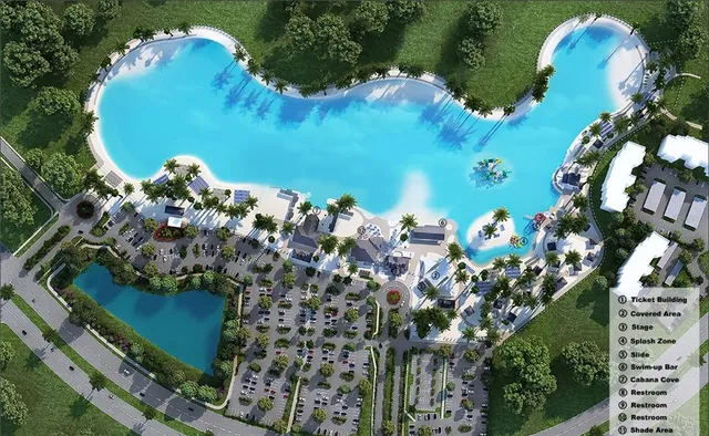 an aerial view of a house a yard and lots of trees