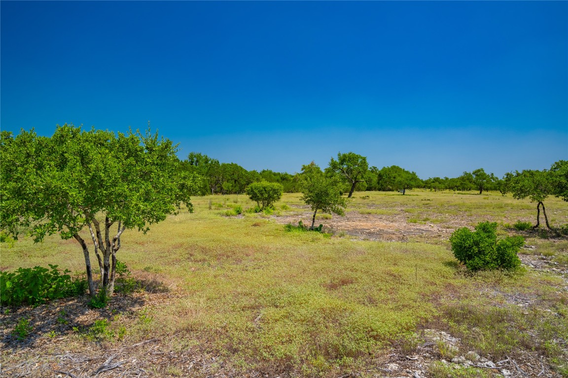 Ranch #6 Ranch Road Austin, TX 78737 - Photo 11 of 32 a view of a lake with houses in the background