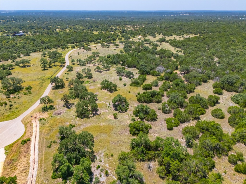 Ranch #6 Ranch Road Austin, TX 78737 - Photo 15 of 32 an aerial view of residential houses with outdoor space and trees