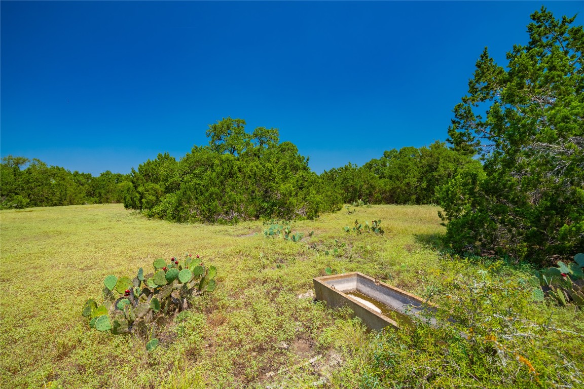 Ranch #6 Ranch Road Austin, TX 78737 - Photo 16 of 32 a view of a field with an ocean
