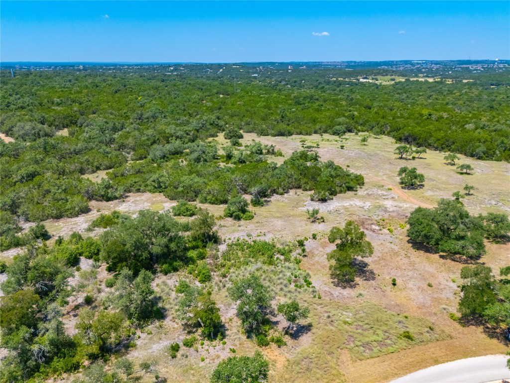 Ranch #6 Ranch Road Austin, TX 78737 - Photo 22 of 32 a view of a lake with beach and green space