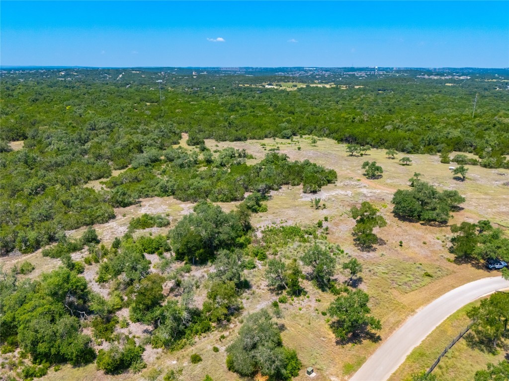 Ranch #6 Ranch Road Austin, TX 78737 - Photo 23 of 32 a view of a lake with beach and green space