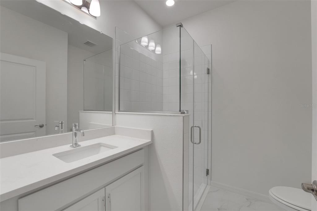 35424 Tuscan Hill Road Dade City, FL 33525 - Photo 15 of 42 a bathroom with a sink and a mirror