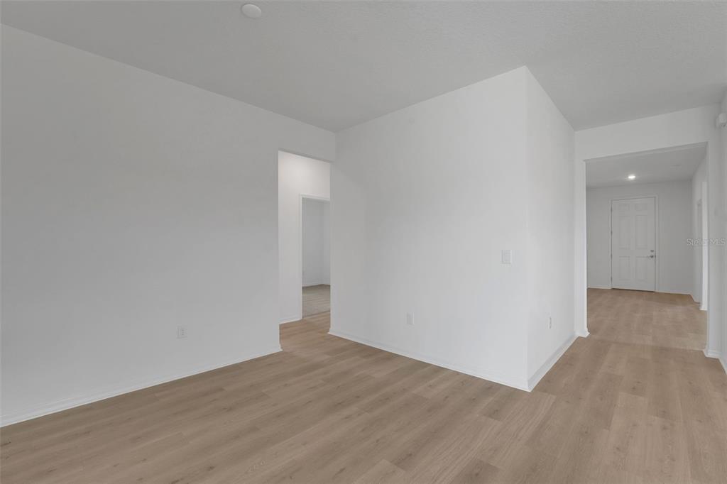 35424 Tuscan Hill Road Dade City, FL 33525 - Photo 18 of 42 wooden floor in an empty room