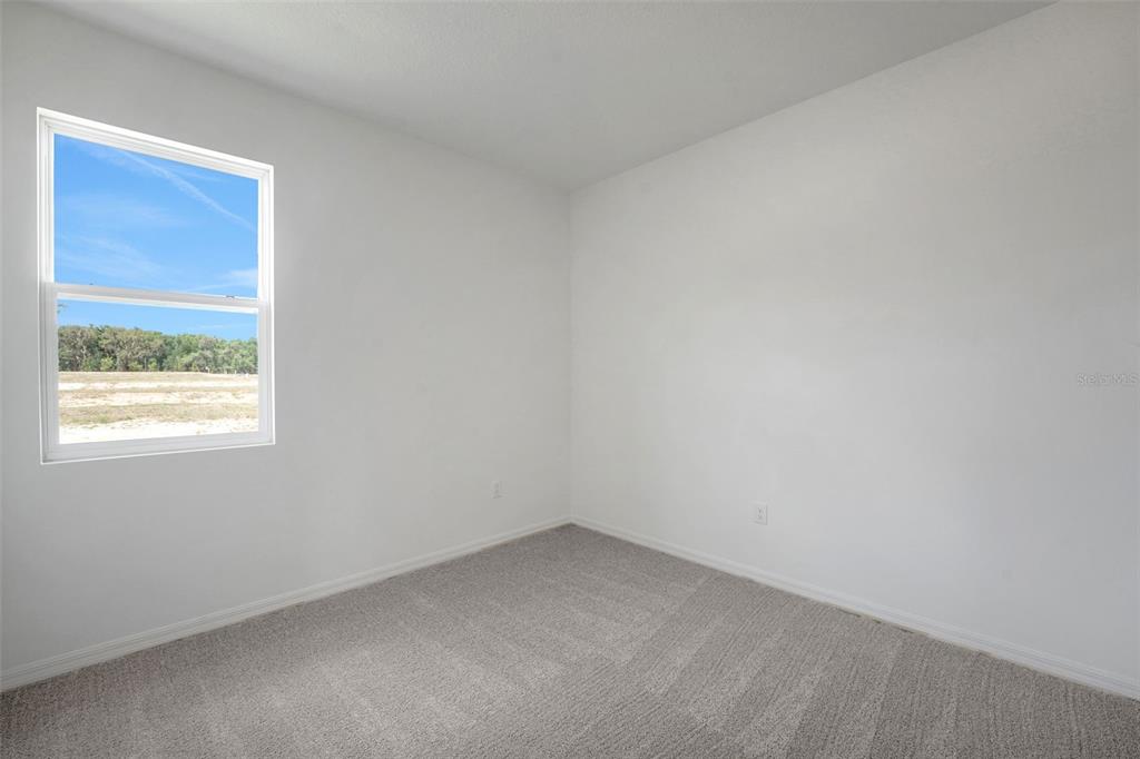 35424 Tuscan Hill Road Dade City, FL 33525 - Photo 27 of 42 an empty room with a window