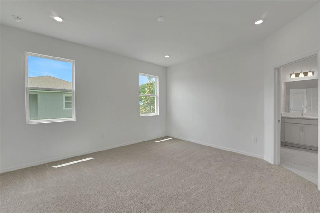 35424 Tuscan Hill Road Dade City, FL 33525 - Photo 31 of 42 an empty room with windows and closet