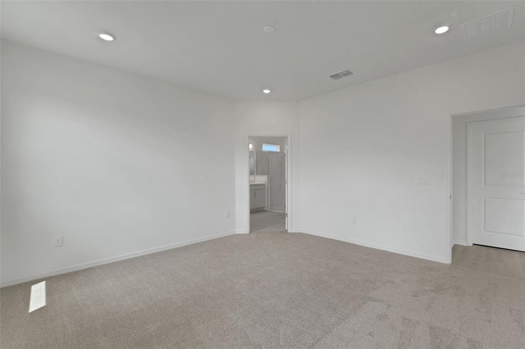 35424 Tuscan Hill Road Dade City, FL 33525 - Photo 32 of 42 an empty room with an entryway