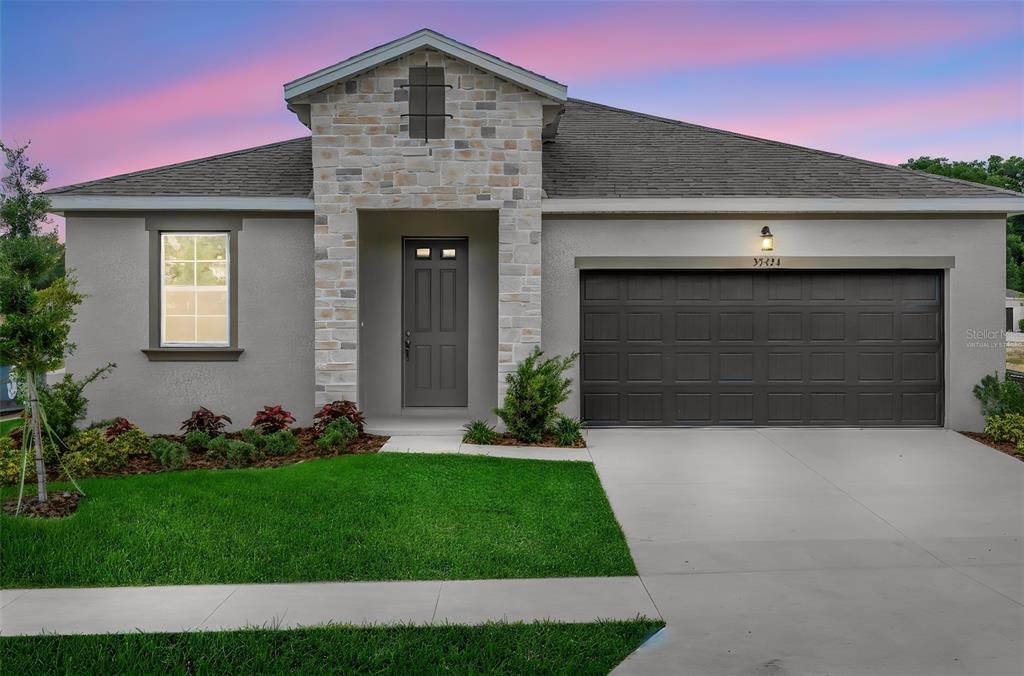 35424 Tuscan Hill Road Dade City, FL 33525 - Photo 4 of 42 a front view of a house with a yard