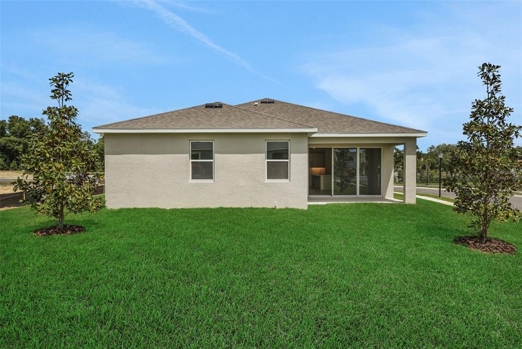 35424 Tuscan Hill Road Dade City, FL 33525 - Photo 41 of 42 a front view of a house with a garden