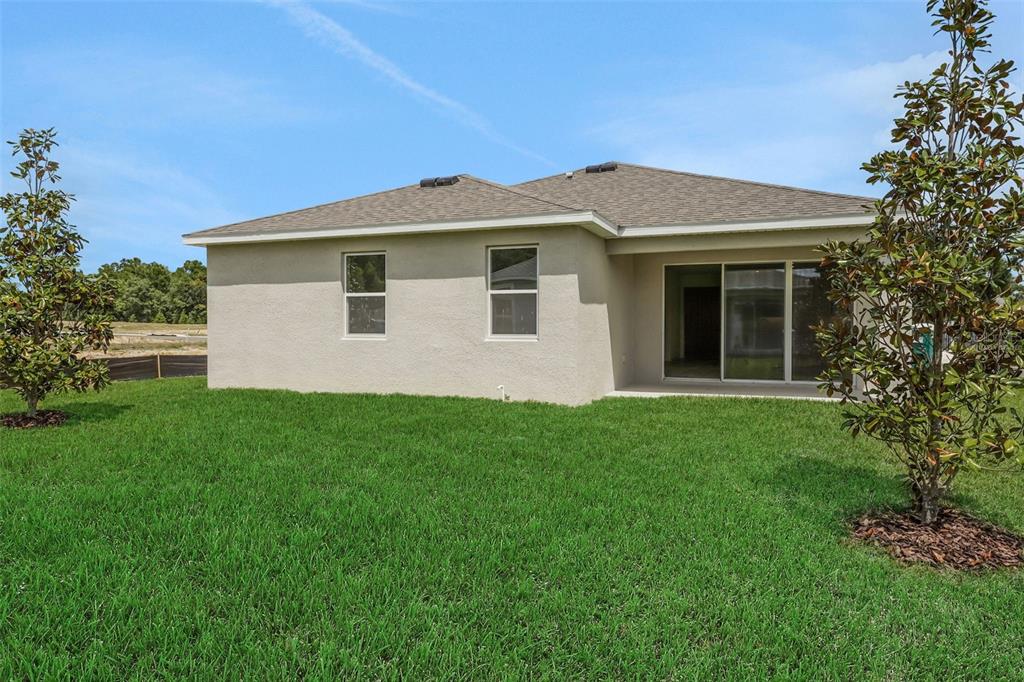 35424 Tuscan Hill Road Dade City, FL 33525 - Photo 42 of 42 a view of a house with a yard