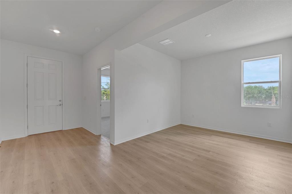35424 Tuscan Hill Road Dade City, FL 33525 - Photo 10 of 42 wooden floor in an empty room