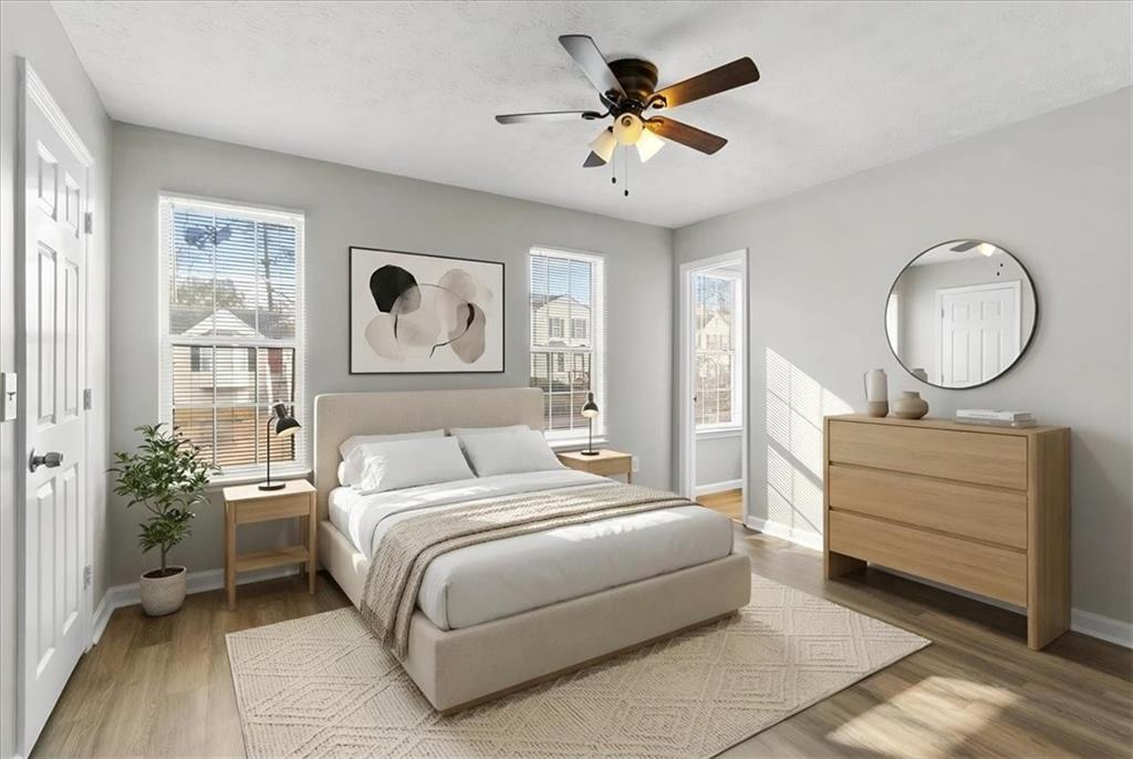 3483 Kingswood Run Decatur, GA 30034 - Photo 11 of 19 a bedroom with a large bed and a chandelier