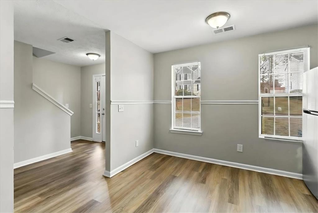 3483 Kingswood Run Decatur, GA 30034 - Photo 3 of 19 an empty room with wooden floor and windows