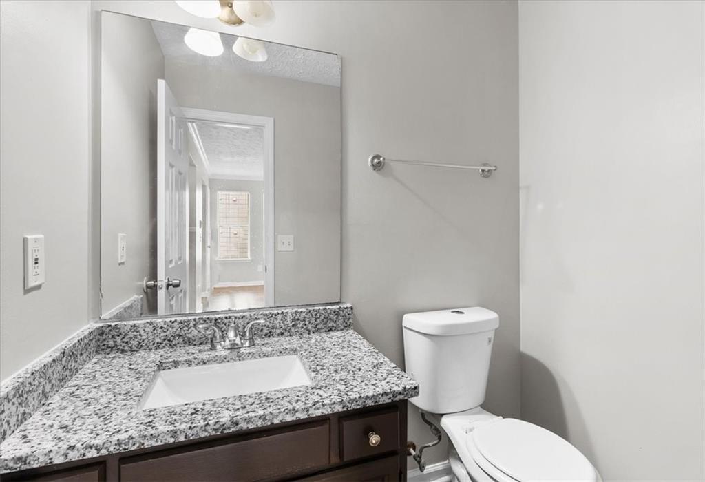 3483 Kingswood Run Decatur, GA 30034 - Photo 10 of 19 a bathroom with a granite countertop sink a large mirror and toilet