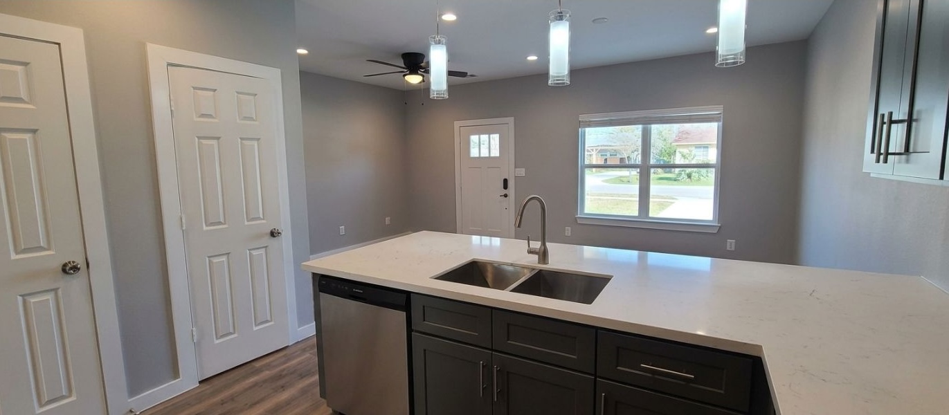9114 Caddo Road, Unit A & B Houston, TX 77078 - Photo 3 of 24 A well-appointed kitchen island with sleek countertops and stainless steel appliances.