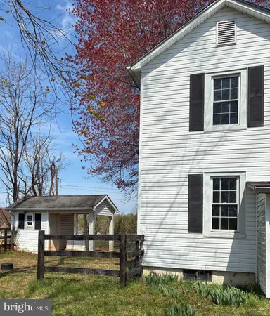 a view of house with yard